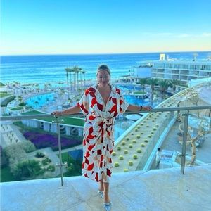 White with geometric print in varying shades of orange. VACATION VIBES! Too big